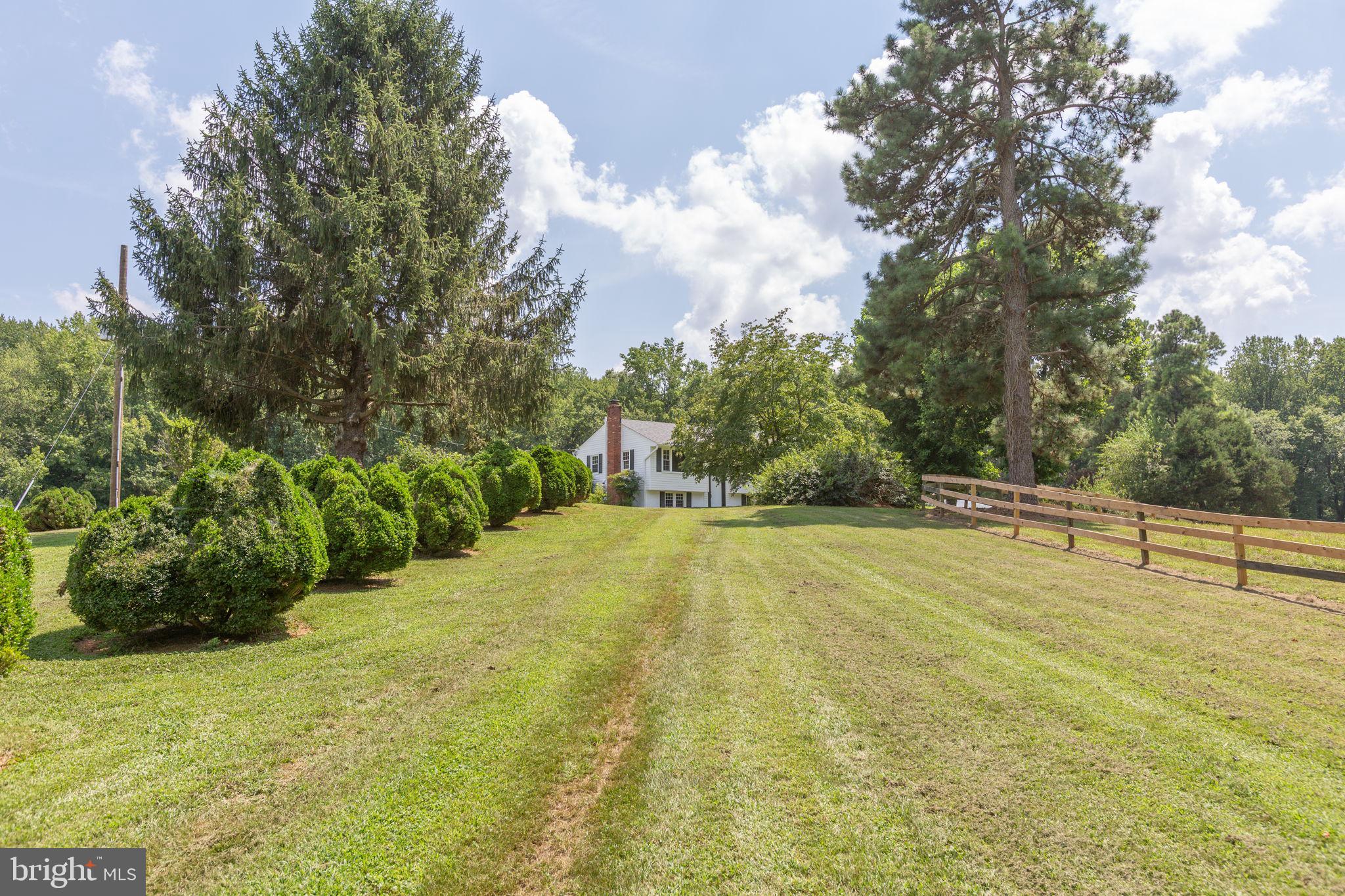 18136 Pepmeier Hill Road Fredericksburg, VA 22408 - Photo 3 of 80 a view of a swimming pool with an outdoor space and seating area