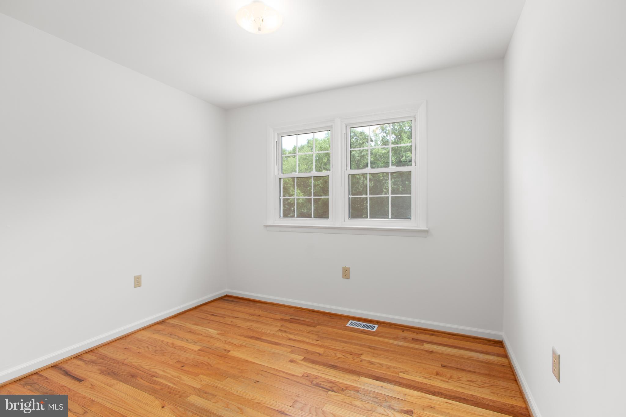 18136 Pepmeier Hill Road Fredericksburg, VA 22408 - Photo 31 of 80 a view of empty room with wooden floor and fan