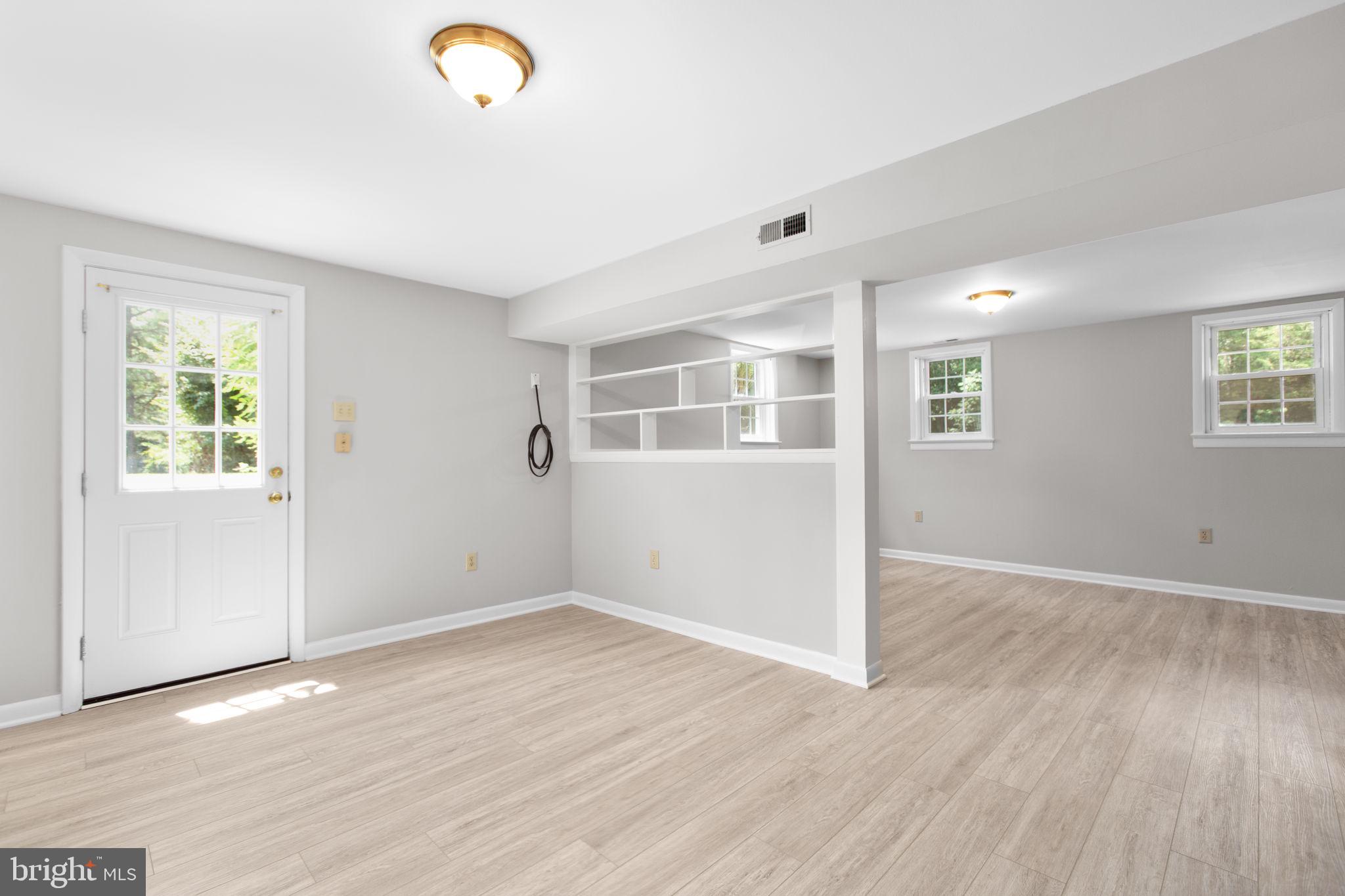 18136 Pepmeier Hill Road Fredericksburg, VA 22408 - Photo 33 of 80 an empty room with wooden floor and windows