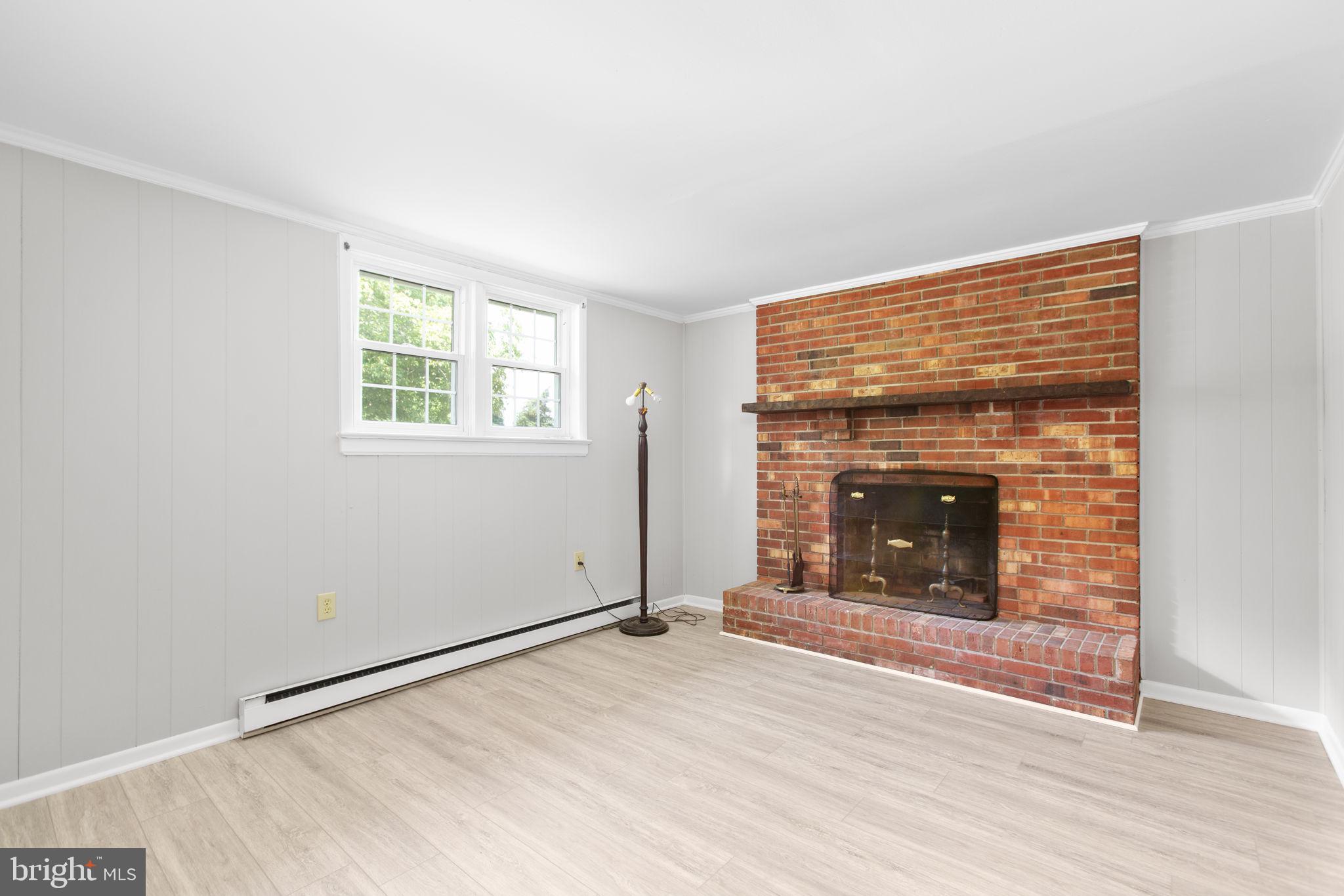 18136 Pepmeier Hill Road Fredericksburg, VA 22408 - Photo 38 of 80 an empty room with windows and fireplace