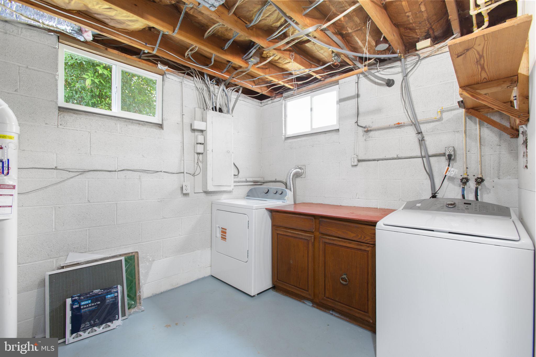 18136 Pepmeier Hill Road Fredericksburg, VA 22408 - Photo 40 of 80 a utility room with cabinets dryer and washer