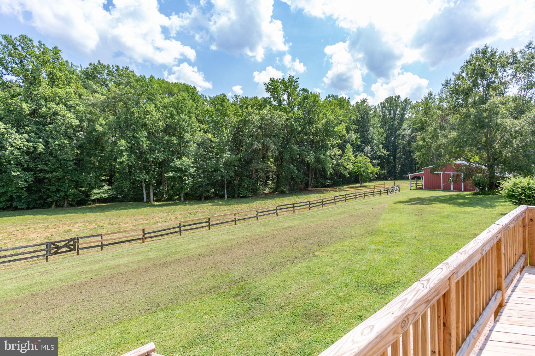 18136 Pepmeier Hill Road Fredericksburg, VA 22408 - Photo 47 of 80 a view of a field with trees in the background