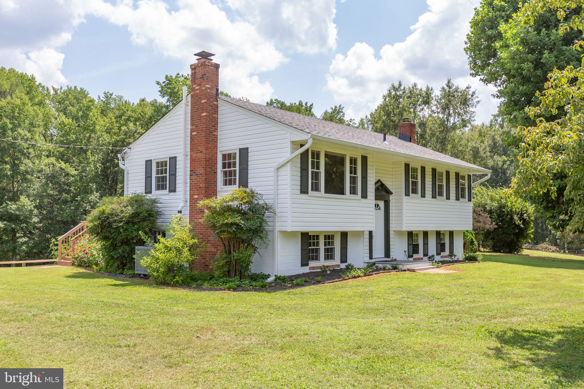 18136 Pepmeier Hill Road Fredericksburg, VA 22408 - Photo 5 of 80 a front view of house with yard and lake view