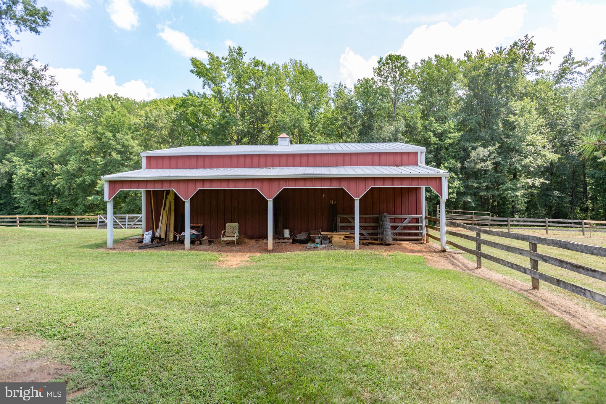 18136 Pepmeier Hill Road Fredericksburg, VA 22408 - Photo 54 of 80 a view of a house with backyard and a garden