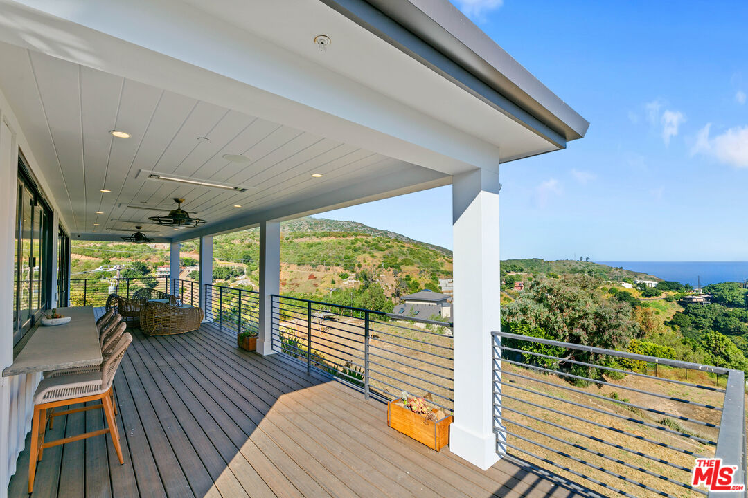 27148 Carrita Road Malibu, CA 90265 - Photo 20 of 27 a view of a balcony with chairs