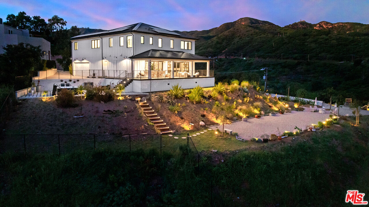 27148 Carrita Road Malibu, CA 90265 - Photo 26 of 27 a view of a house with a garden