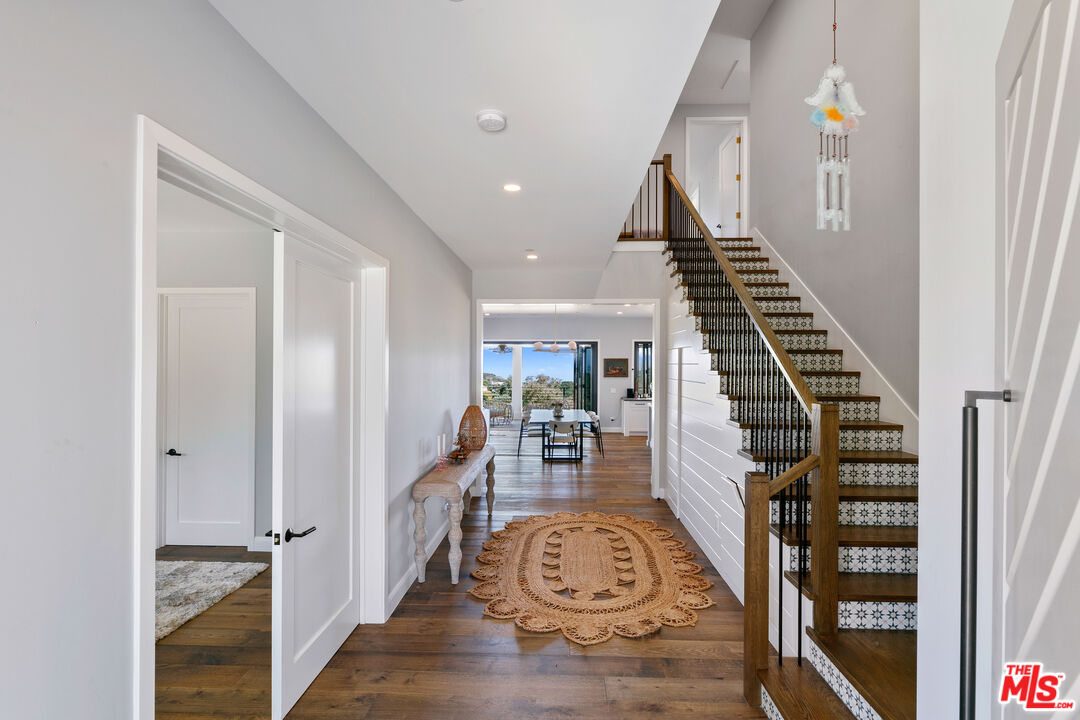 27148 Carrita Road Malibu, CA 90265 - Photo 8 of 27 a view of entryway and hall with wooden floor
