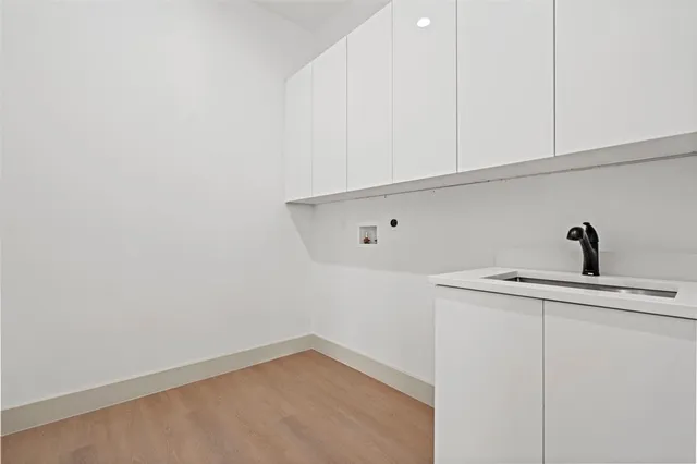 a kitchen with a sink and cabinets