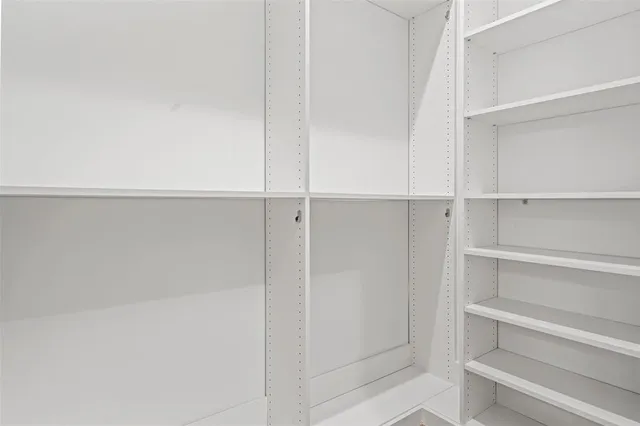 a view of an empty walk in closet
