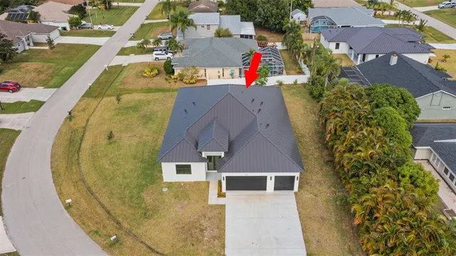 an aerial view of a house with swimming pool