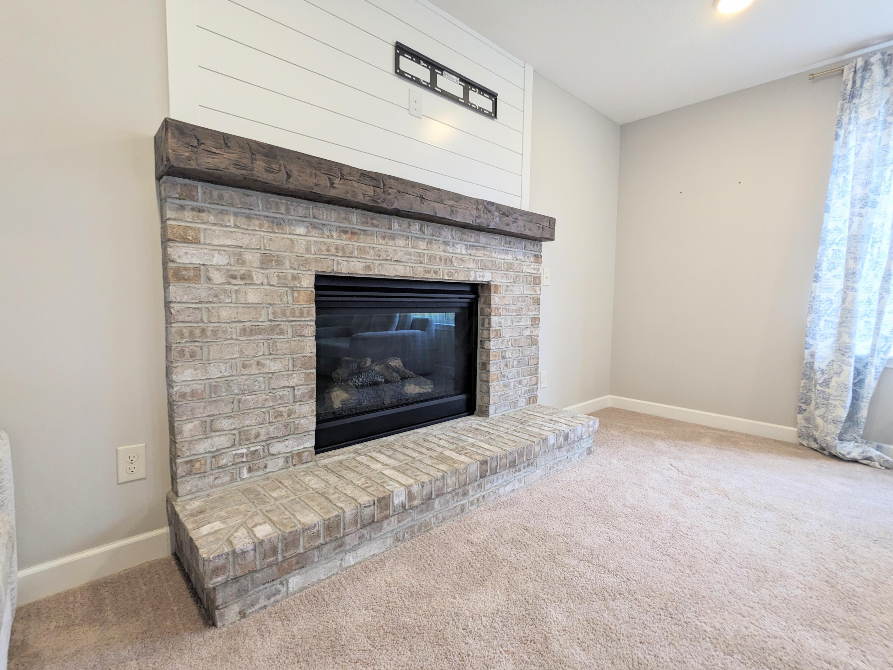 3233 South County Line Road Johnstown, OH 43031 - Photo 9 of 35 Brick gas log fireplace.