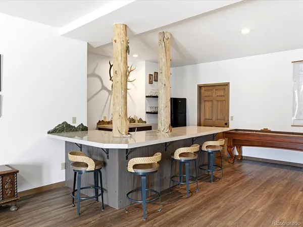 a view of a kitchen with a table and chairs