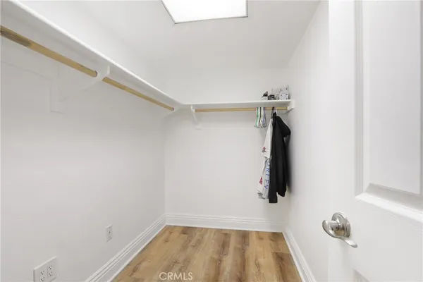 a bedroom with a bed and a ceiling fan
