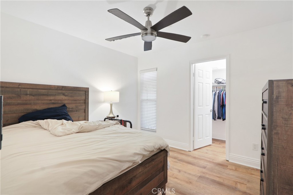 1440 West Lambert Road, Unit 233 La Habra, CA 90631 - Photo 17 of 26 a bedroom with a bed and a ceiling fan