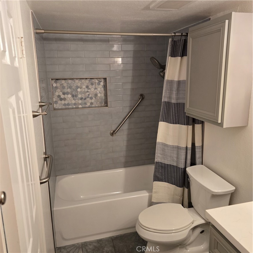 1440 West Lambert Road, Unit 233 La Habra, CA 90631 - Photo 20 of 26 a white toilet sitting next to a bath tub