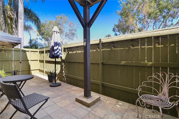 a view of a porch with chairs and front door