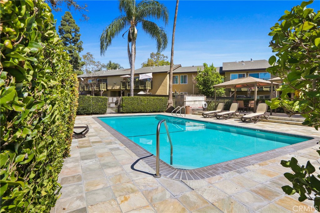 1440 West Lambert Road, Unit 233 La Habra, CA 90631 - Photo 25 of 26 a view of a swimming pool with a patio