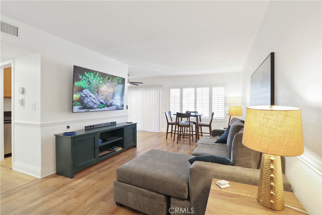 1440 West Lambert Road, Unit 233 La Habra, CA 90631 - Photo 3 of 26 a living room with furniture and a flat screen tv