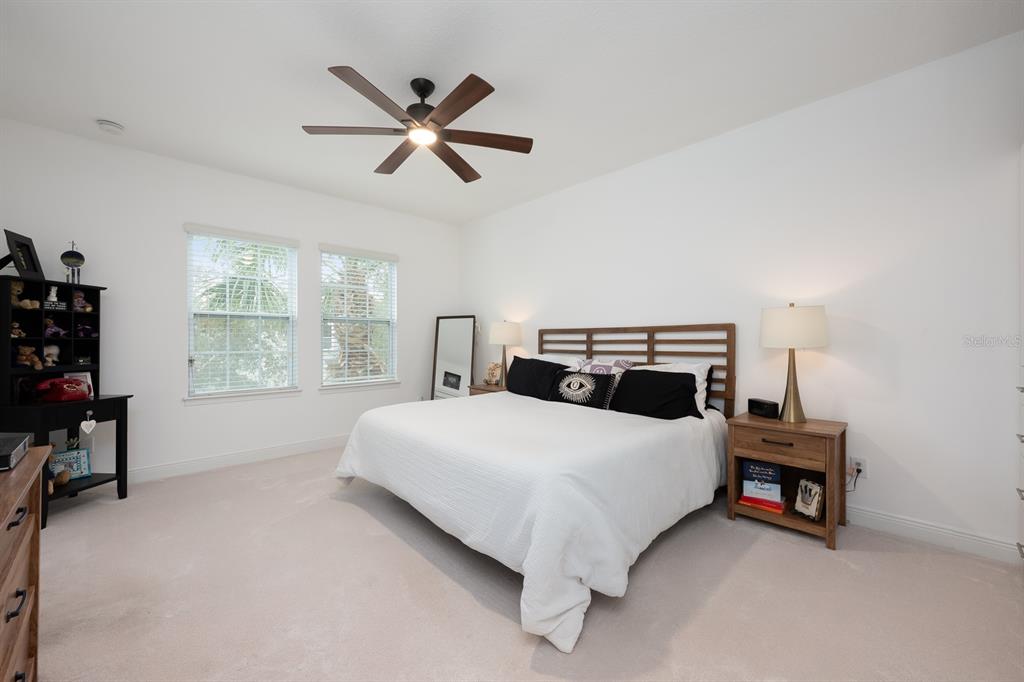 12305 Via Derna Place Windermere, FL 34786 - Photo 11 of 24 a bedroom with a bed and a window
