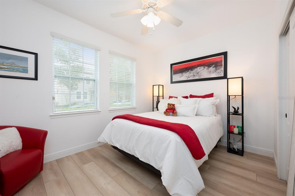 12305 Via Derna Place Windermere, FL 34786 - Photo 19 of 24 a bed room with a bed and a chair