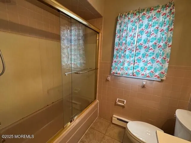 a bathroom with a toilet and shower