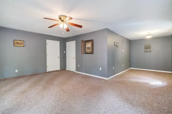 a view of a livingroom with a ceiling fan