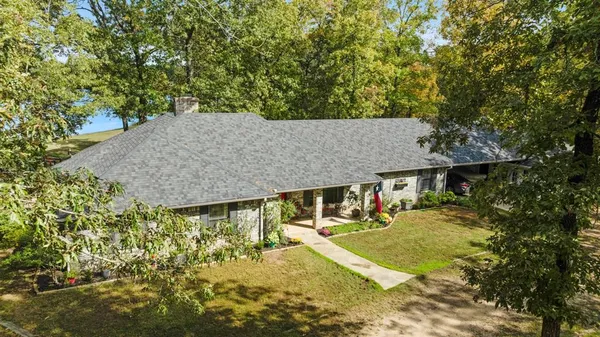 aerial view of a house with swimming pool and sitting area