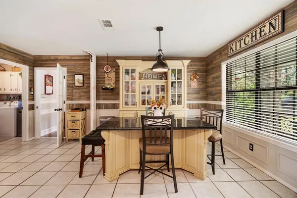 a view of a livingroom with furniture and window
