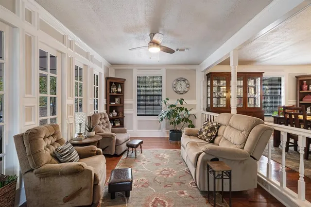 a living room with furniture or couch and a large window