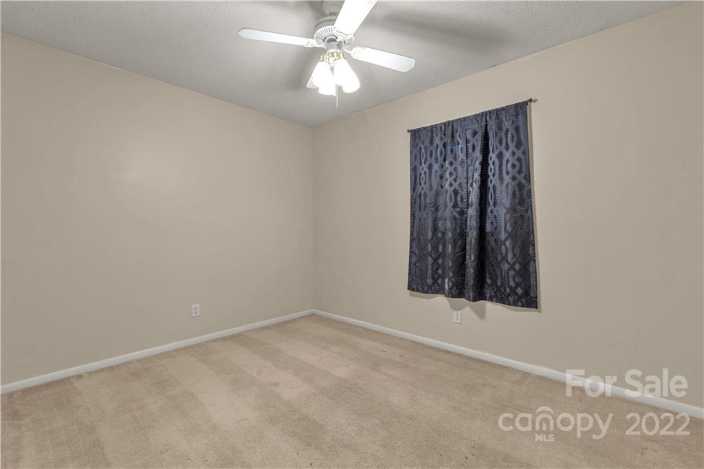 1909 John Everall Road Lancaster, SC 29720 - Photo 15 of 32 an empty room with a window and a fan