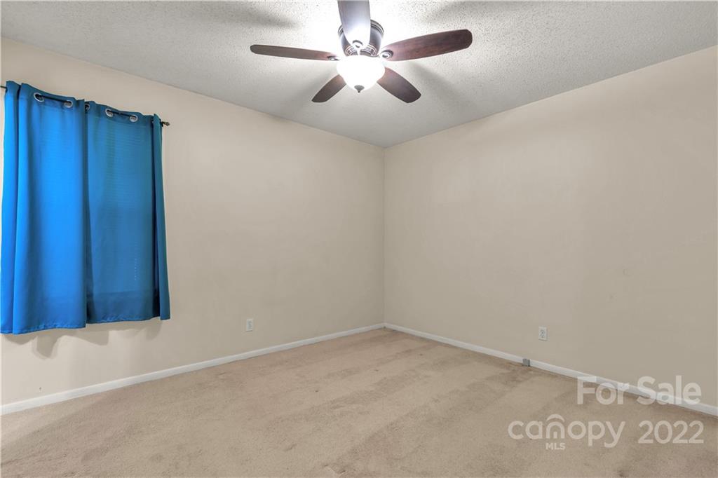 1909 John Everall Road Lancaster, SC 29720 - Photo 17 of 32 an empty room with a ceiling fan and fan