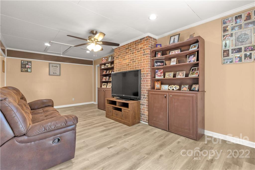 1909 John Everall Road Lancaster, SC 29720 - Photo 21 of 32 a living room with furniture and a flat screen tv