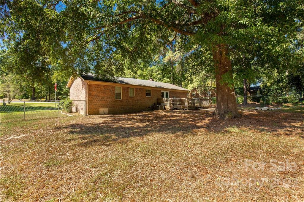 1909 John Everall Road Lancaster, SC 29720 - Photo 24 of 32 a view of a house with backyard and trees