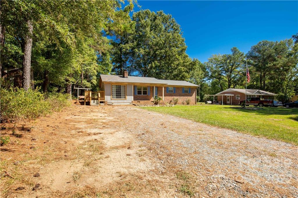 1909 John Everall Road Lancaster, SC 29720 - Photo 26 of 32 a view of house with yard and outdoor seating