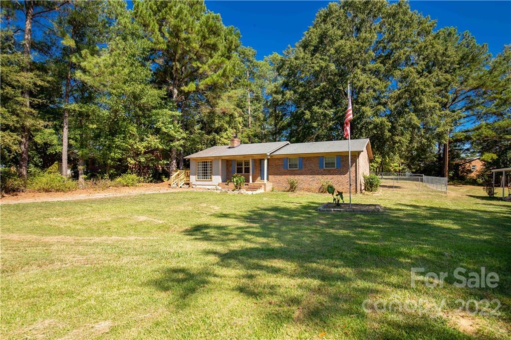 1909 John Everall Road Lancaster, SC 29720 - Photo 4 of 32 a front view of a house with a yard