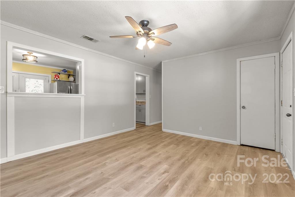 1909 John Everall Road Lancaster, SC 29720 - Photo 7 of 32 a view of an empty room with window and wooden floor