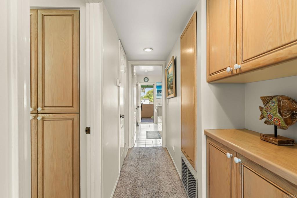 1105 Reed Avenue San Diego, CA 92109 - Photo 20 of 34 a view of a hallway to a bedroom and wooden floor