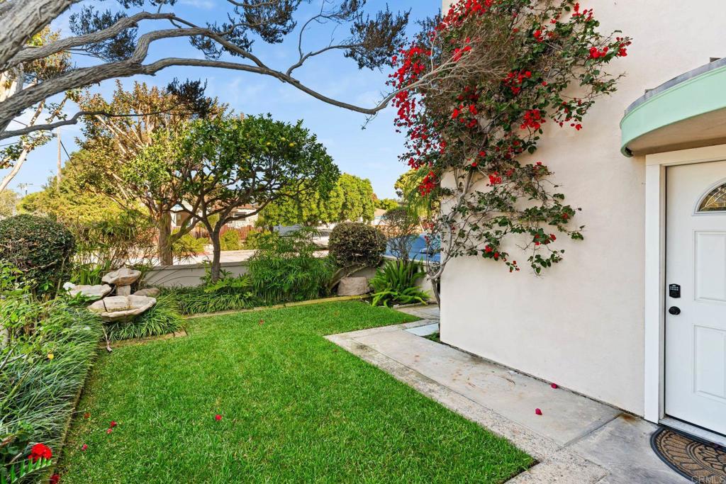1105 Reed Avenue San Diego, CA 92109 - Photo 4 of 34 a view of a backyard with table and chairs and potted plants