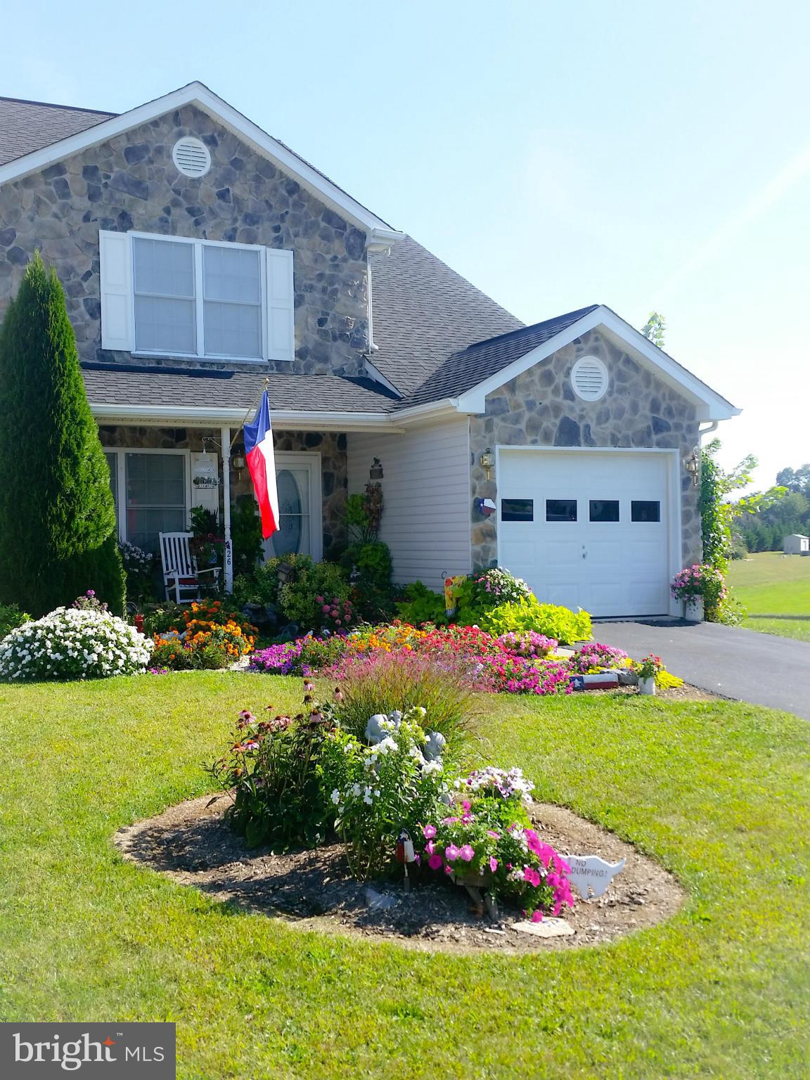 426 Thumper Drive Ranson, WV 25438 - Photo 1 of 30 a front view of house with yard and outdoor seating