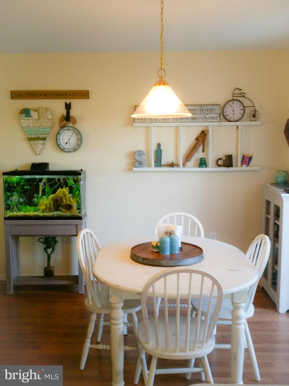 426 Thumper Drive Ranson, WV 25438 - Photo 11 of 30 a view of a dining room with furniture and wooden floor