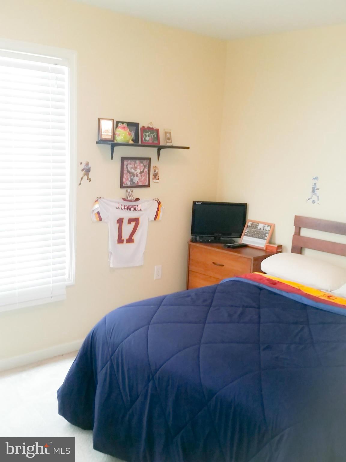 426 Thumper Drive Ranson, WV 25438 - Photo 20 of 30 a bedroom with a bed and two windows