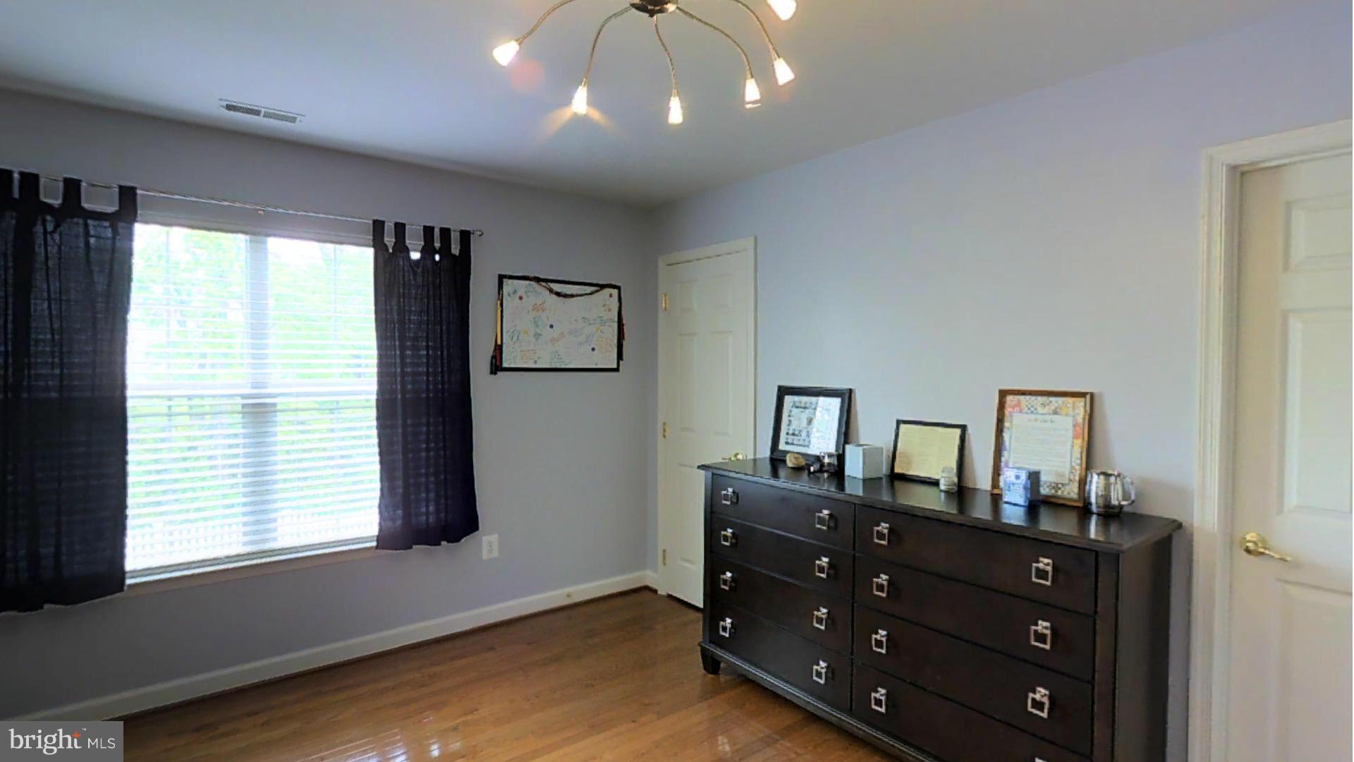 1711 Canal Clipper Court Point of Rocks, MD 21777 - Photo 12 of 30 a room with a dresser and a window