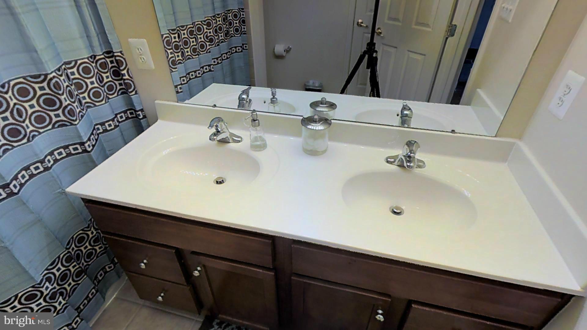1711 Canal Clipper Court Point of Rocks, MD 21777 - Photo 13 of 30 a bathroom with a sink and a mirror