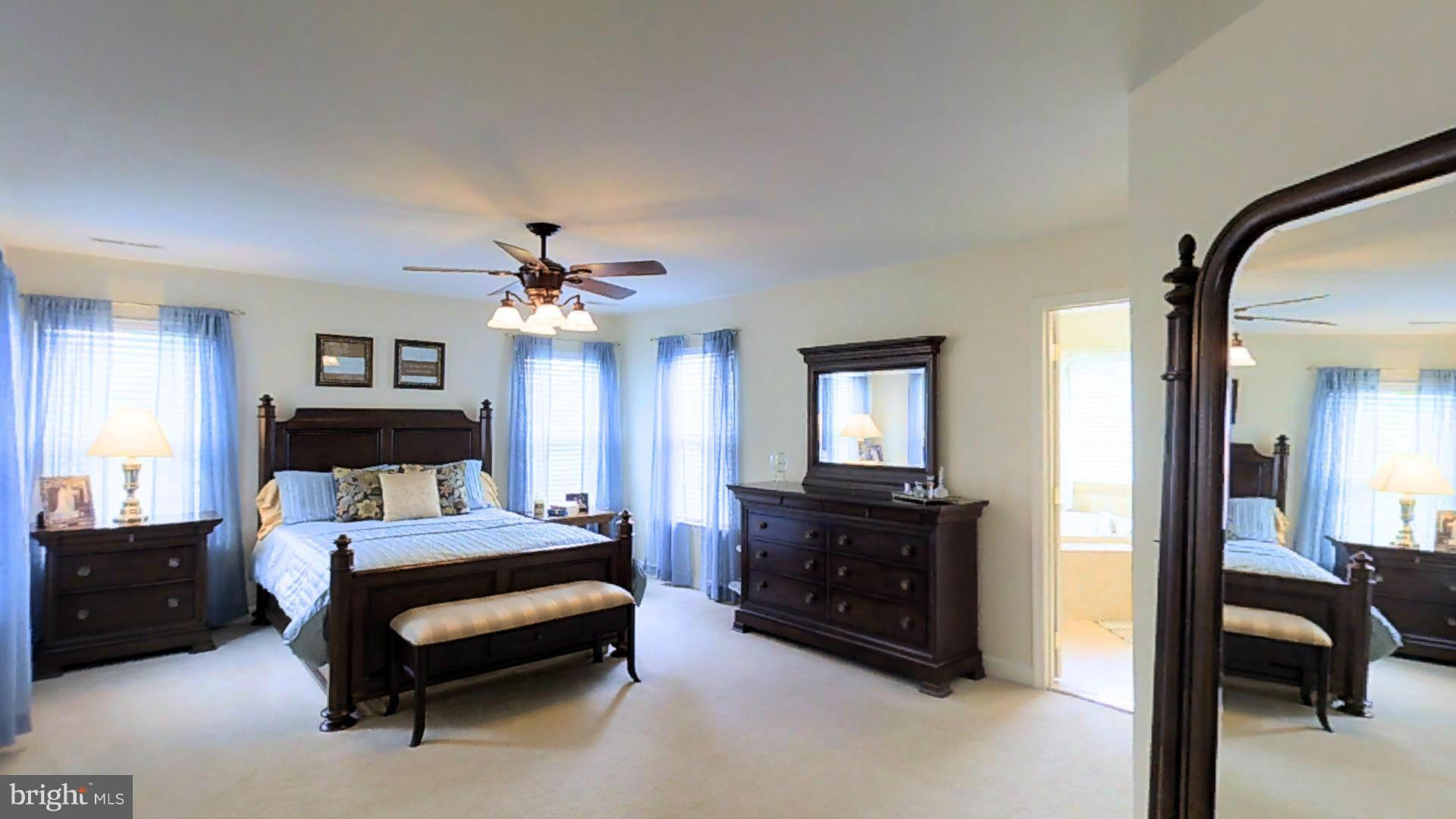 1711 Canal Clipper Court Point of Rocks, MD 21777 - Photo 16 of 30 a bedroom with a bed and a chandelier