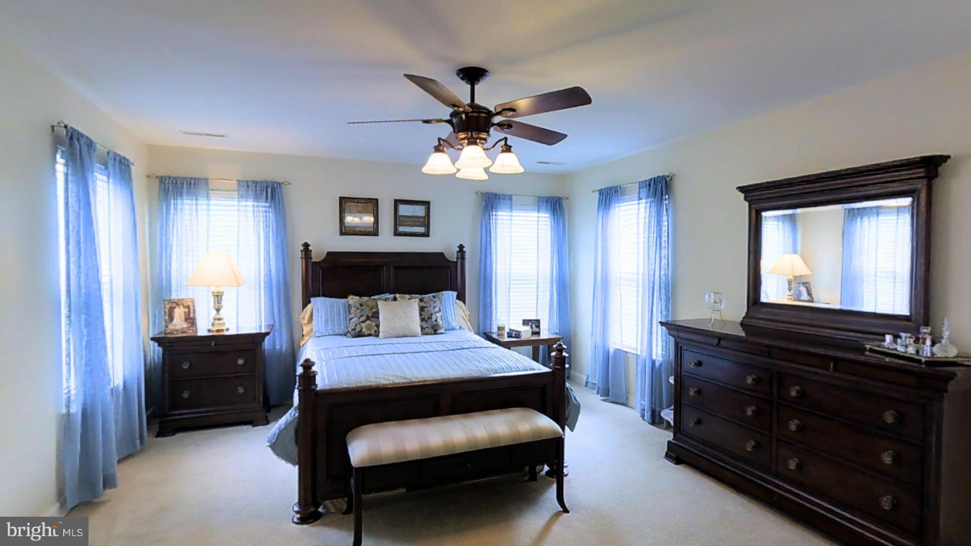 1711 Canal Clipper Court Point of Rocks, MD 21777 - Photo 17 of 30 a bedroom with a bed and a chandelier