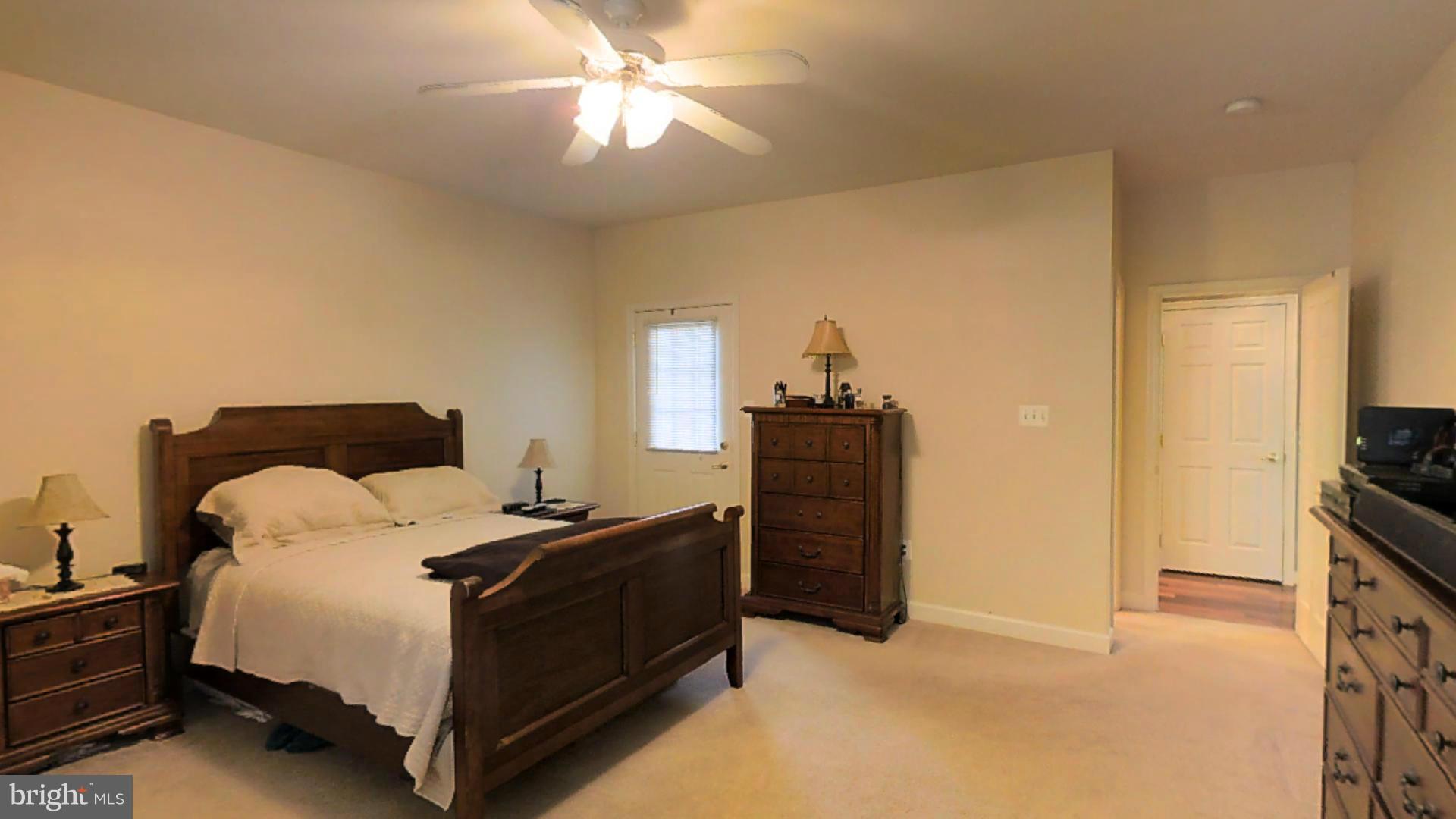 1711 Canal Clipper Court Point of Rocks, MD 21777 - Photo 10 of 30 a bedroom with a bed and a chandelier