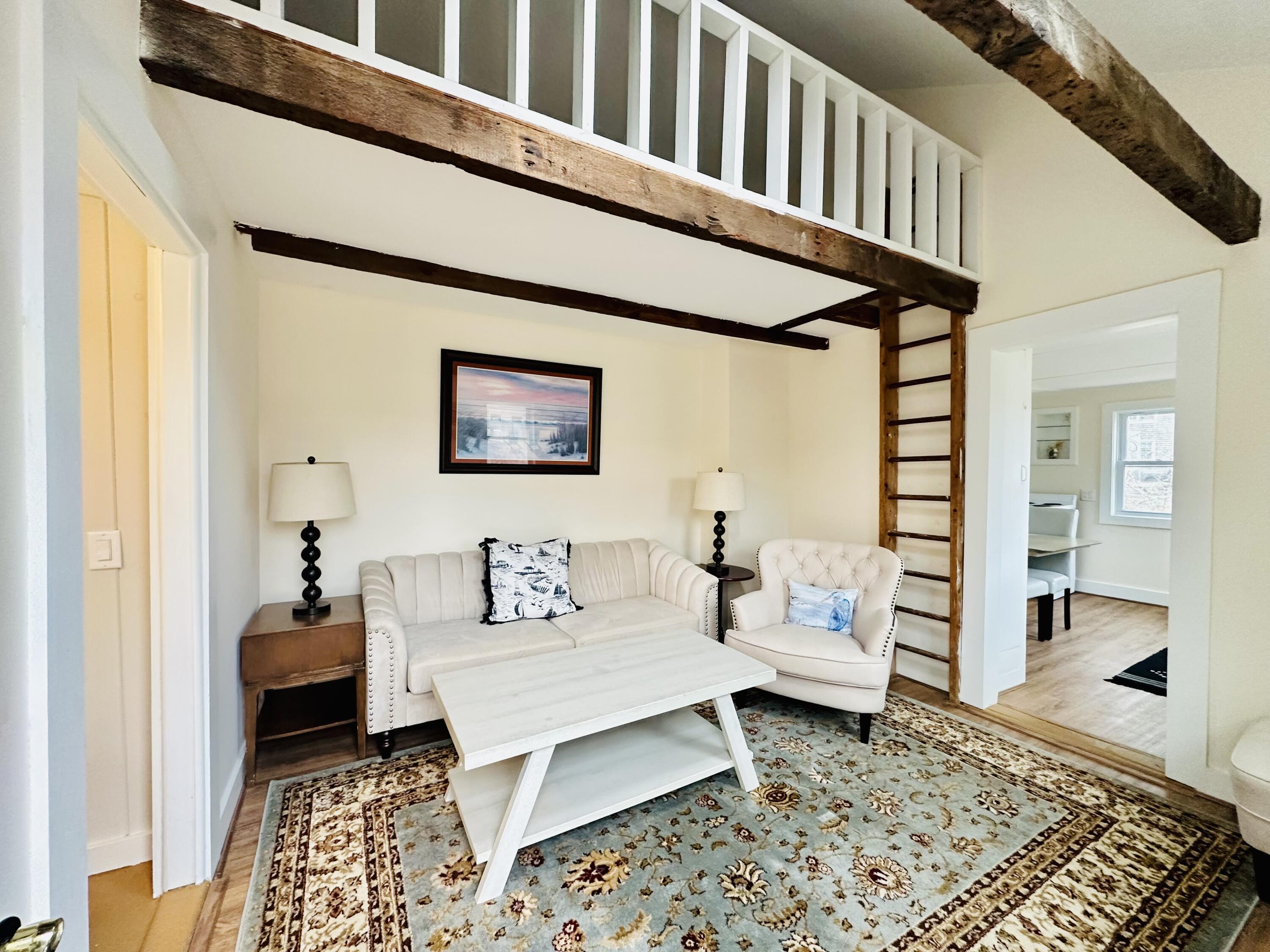36 Cove Road Wellfleet, MA 02667 - Photo 10 of 22 a living room with furniture and a rug