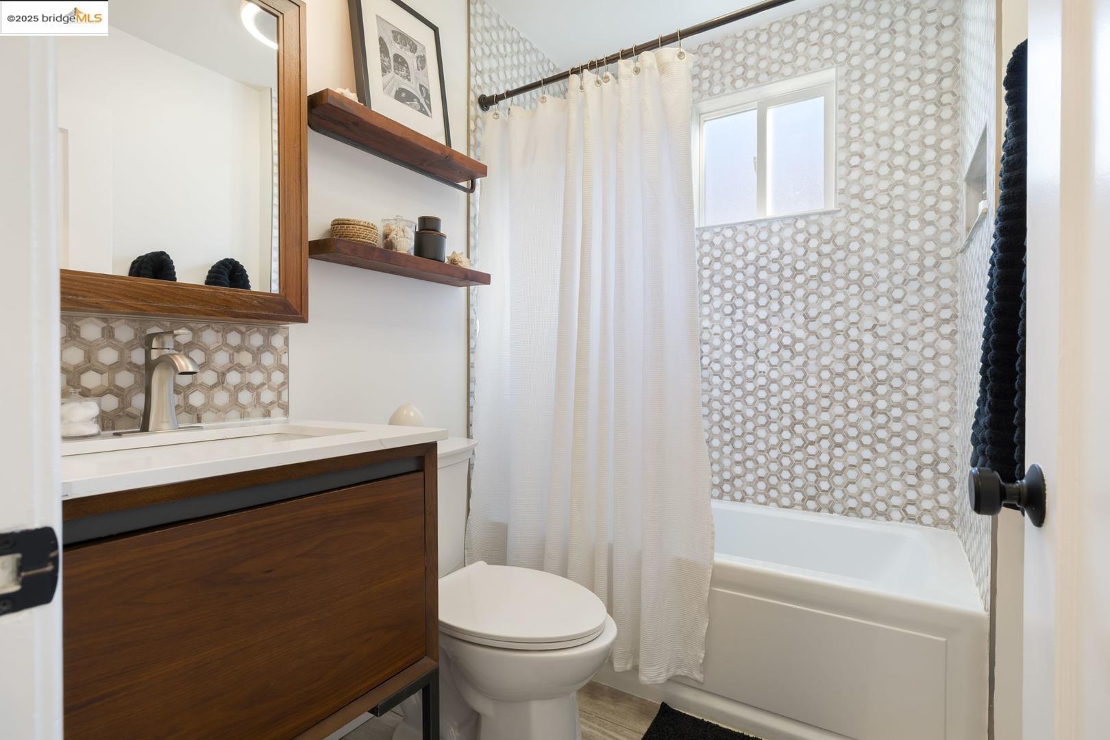 2829 California Street Berkeley, CA 94703 - Photo 13 of 20 a bathroom with a sink toilet and shower