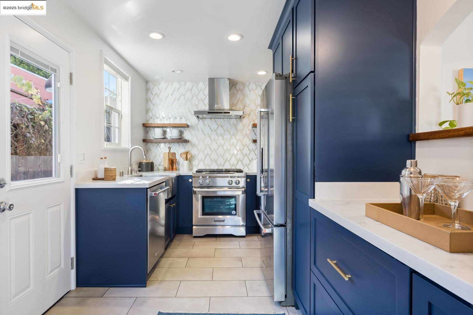 2829 California Street Berkeley, CA 94703 - Photo 9 of 20 a kitchen with kitchen island granite countertop wooden cabinets and stainless steel appliances