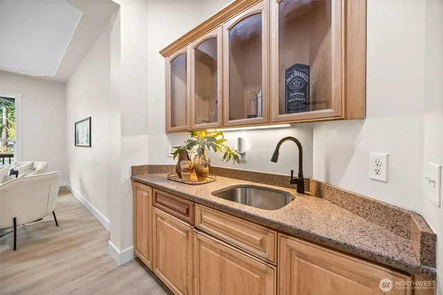 a kitchen with sink and cabinets